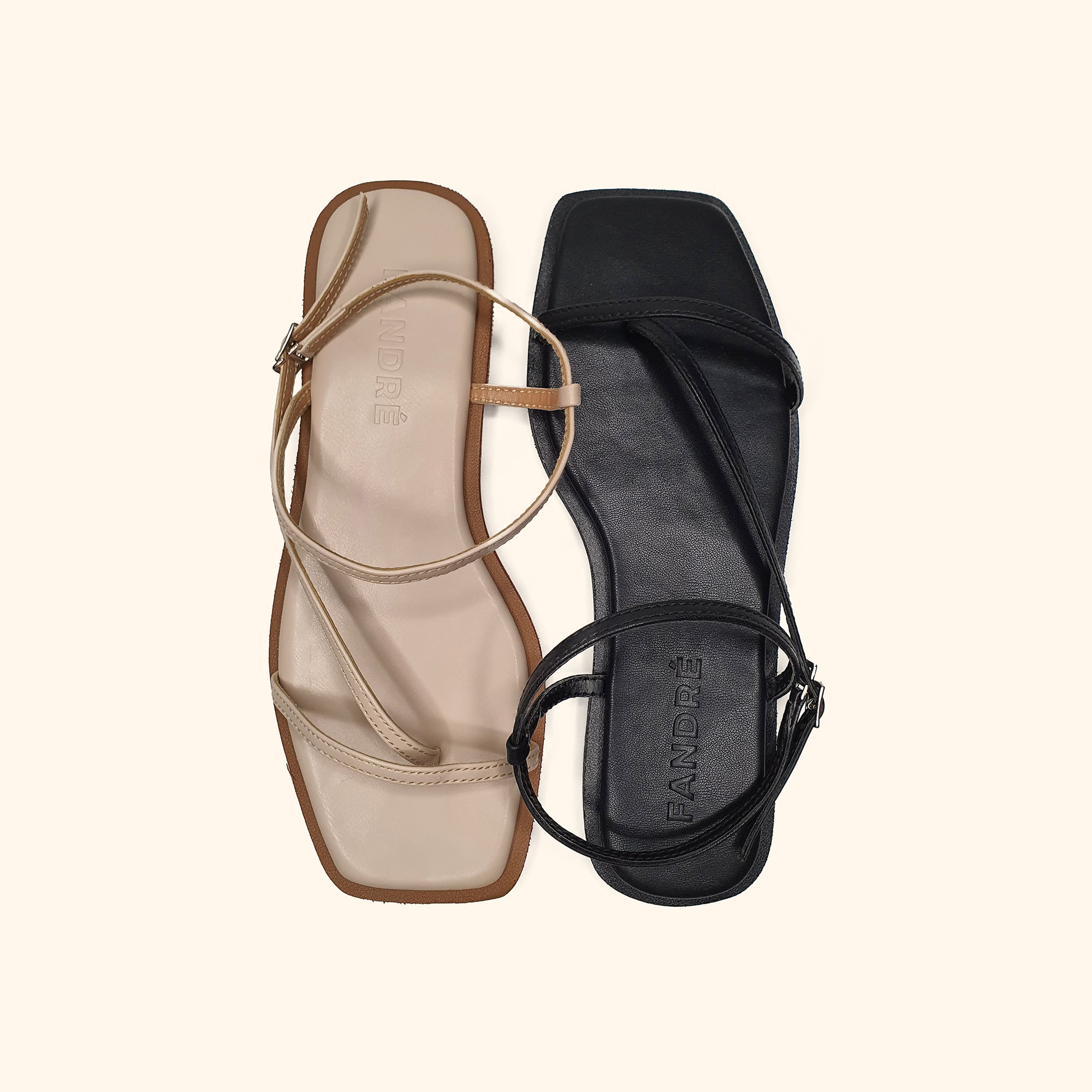 black and beige flat sandals for women up view