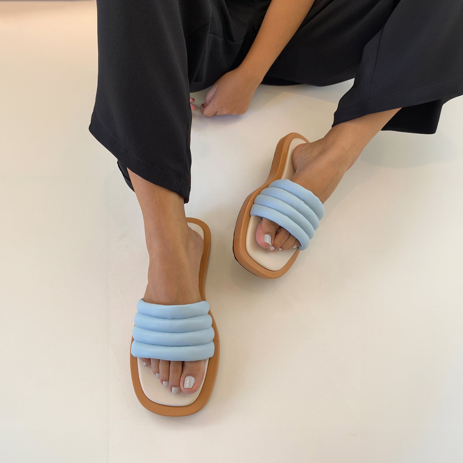 Blue flatform sandals for women being weared
