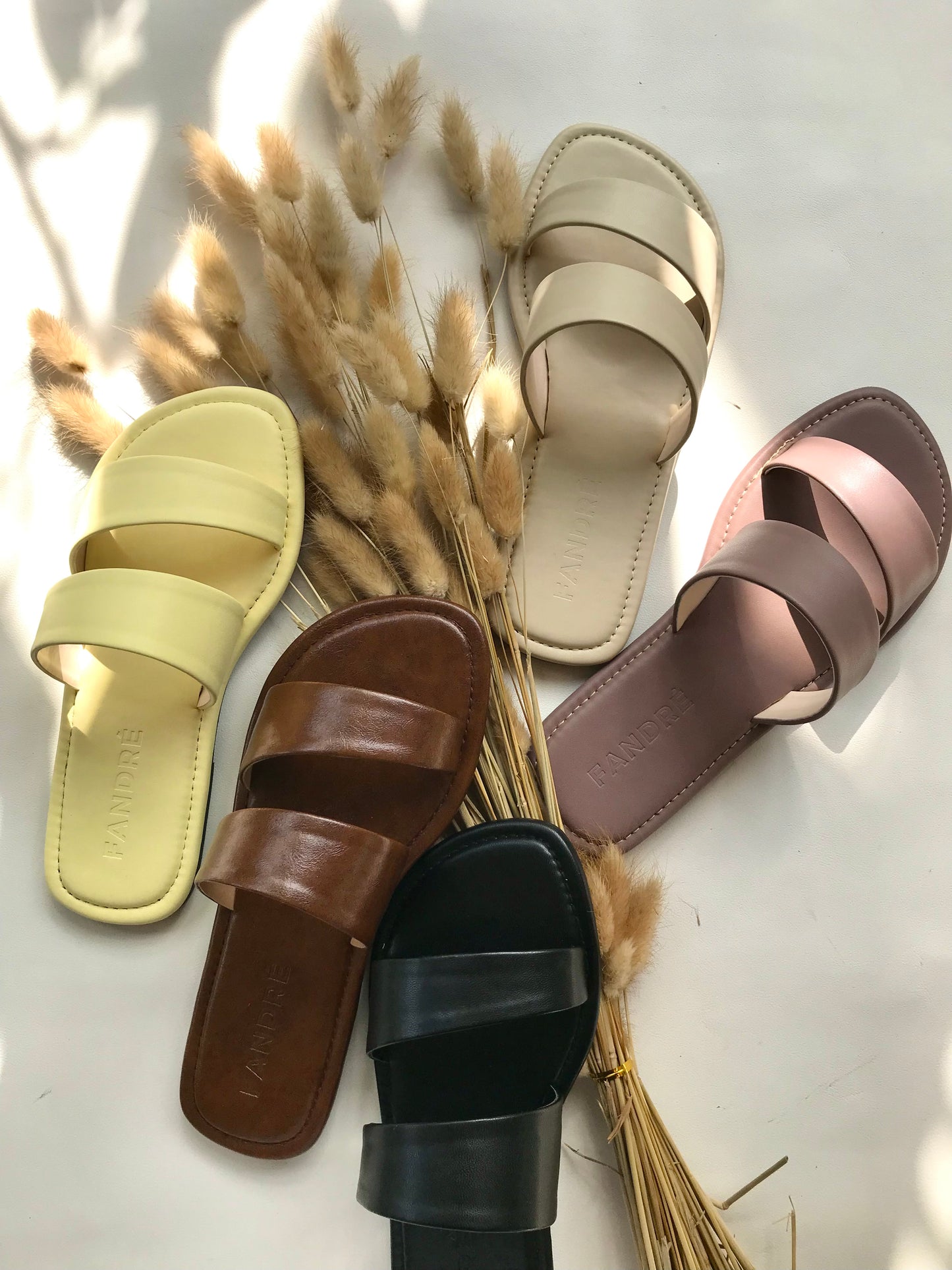 Image showing the color variations of flat sandals for women.