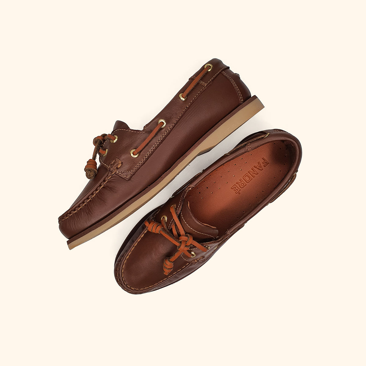 Women's brown leather boatshoes up and side view