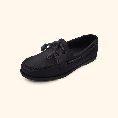 women's black leather boatshoes upside view